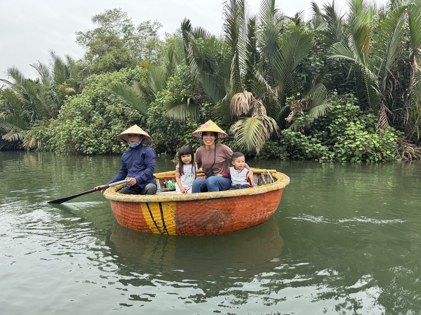 me and the kids in a boat in Hoi An, Vietnam